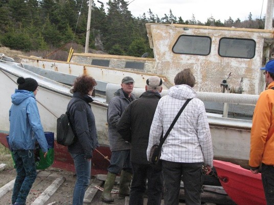 Kemp Stanton( lobster fisherman) showing and telling our visitors to Whale Cove Campground a few things about the boats.